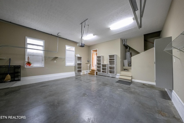 garage with a garage door opener and gas water heater