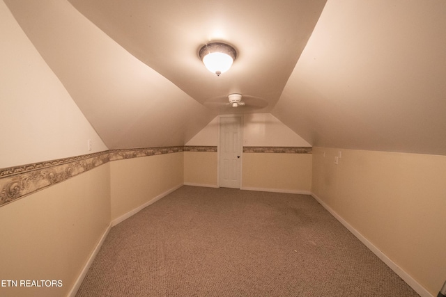 bonus room featuring carpet floors and vaulted ceiling