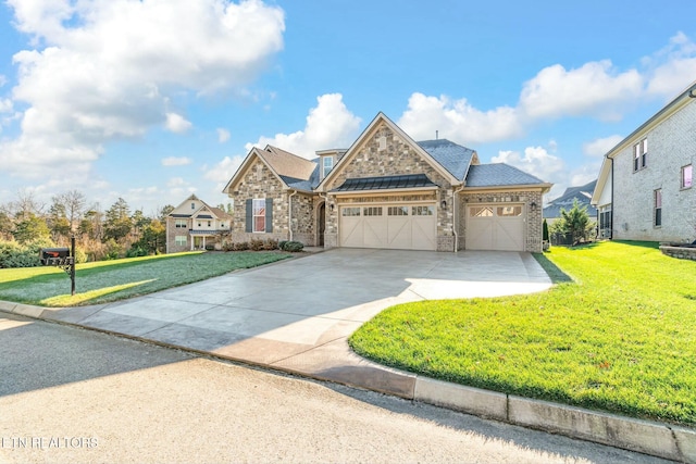 view of front of home featuring a garage and a front lawn