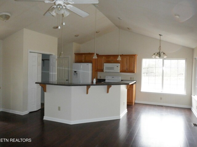 296 Georgee Rd, Jamestown, TN 38556 - kitchen featuring a breakfast bar, white appliances, dark wood-type flooring, pendant lighting, and a center island