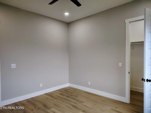 spare room with ceiling fan and light hardwood / wood-style floors