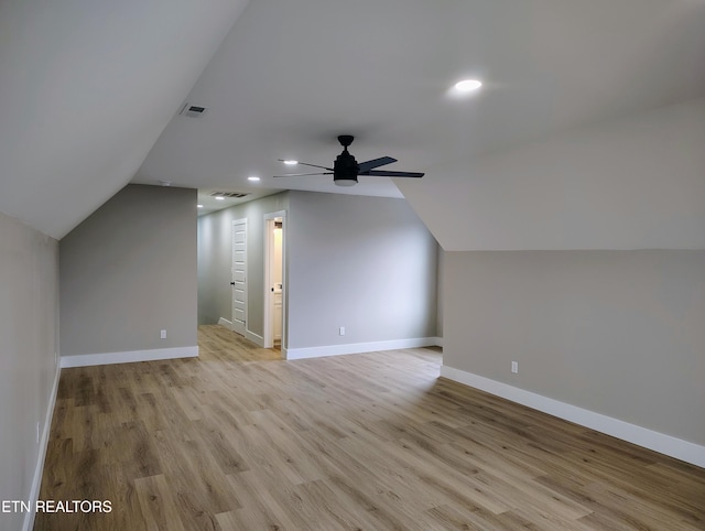 bonus room featuring ceiling fan, light hardwood / wood-style flooring, and vaulted ceiling