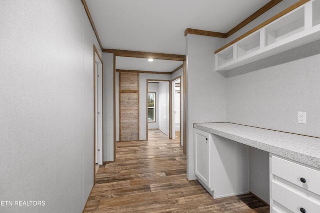 hall with crown molding and dark hardwood / wood-style floors