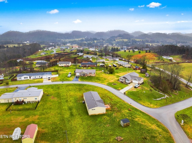 birds eye view of property with a mountain view