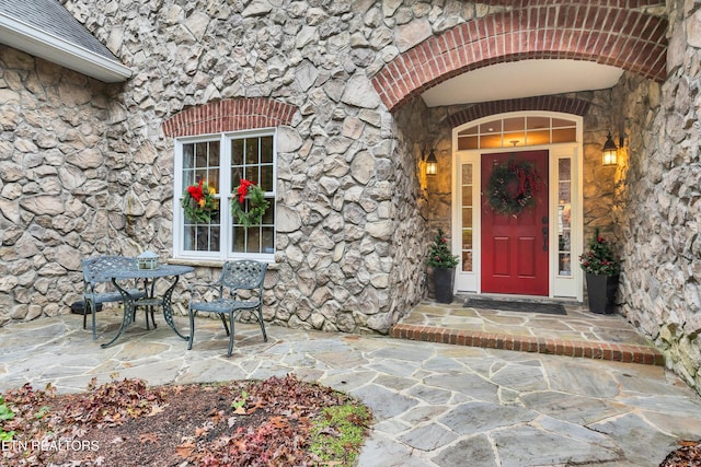 entrance to property with a patio area