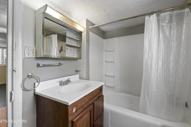 1886 5th St, Jellico, TN 37762 - bathroom featuring vanity, shower / bath combo, and a textured ceiling