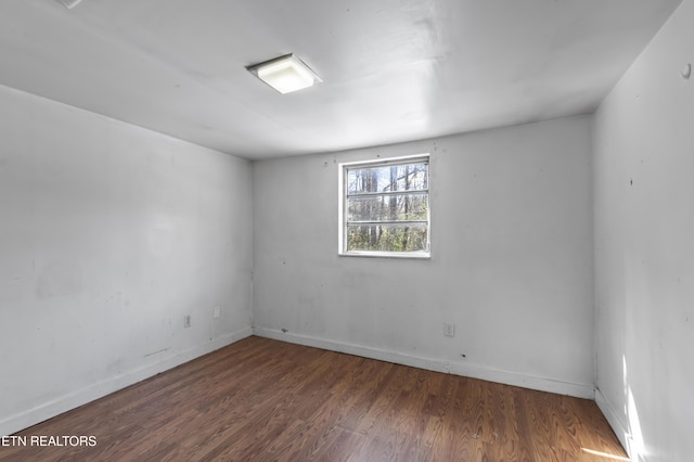 1886 5th St, Jellico, TN 37762 - empty room with dark hardwood / wood-style flooring