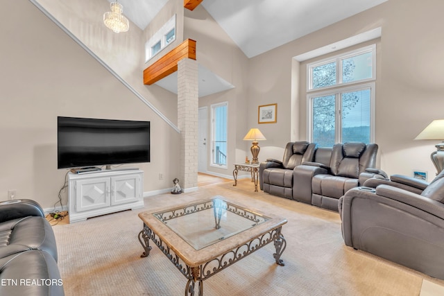 carpeted living room featuring beamed ceiling and high vaulted ceiling