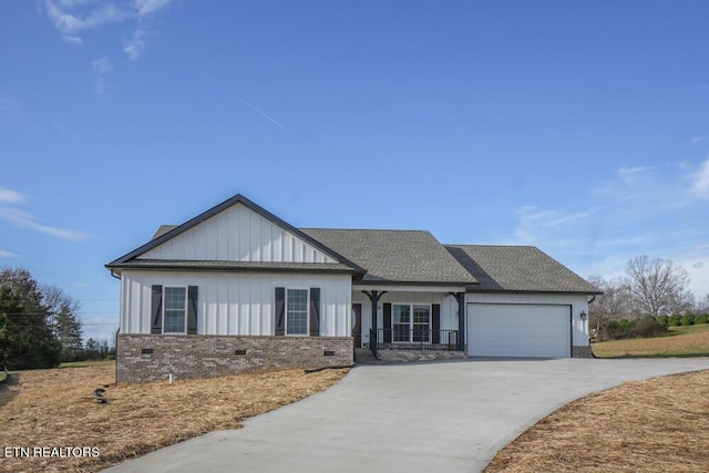 view of front of property featuring a porch and a garage