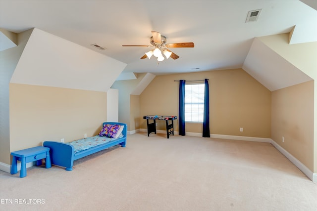 carpeted bedroom with ceiling fan and lofted ceiling