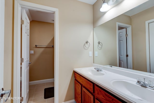 bathroom featuring tile patterned flooring and vanity