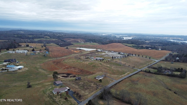 birds eye view of property with a rural view