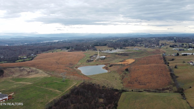 aerial view with a water view and a rural view