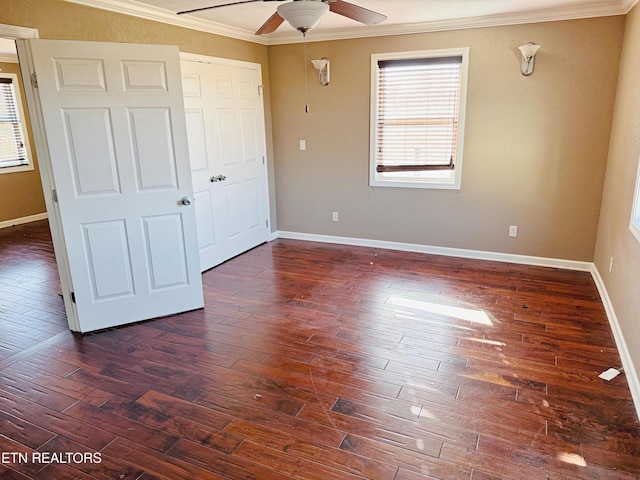 unfurnished bedroom with ceiling fan, ornamental molding, dark hardwood / wood-style floors, and a closet