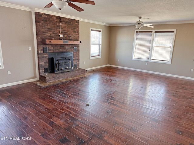 unfurnished living room featuring crown molding, ceiling fan, dark hardwood / wood-style floors, and a textured ceiling