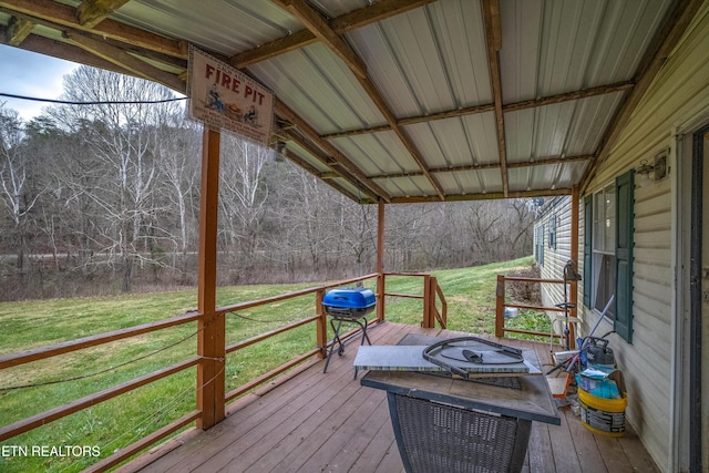 wooden deck with a yard