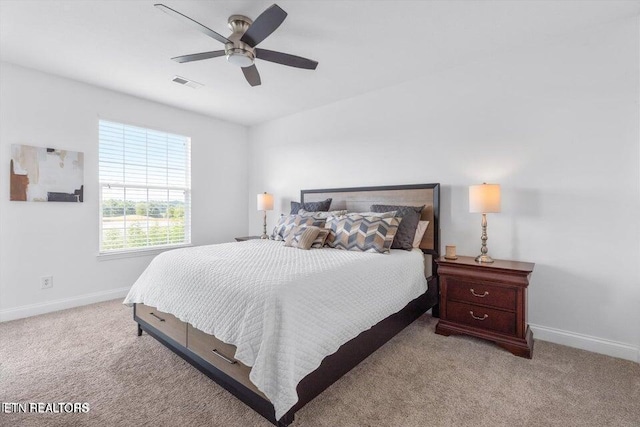 bedroom featuring ceiling fan and light colored carpet