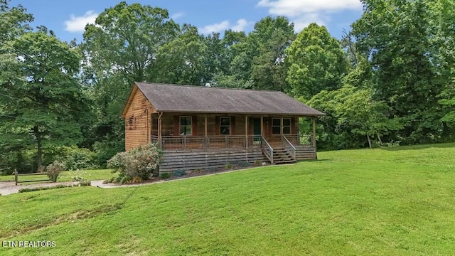 view of front of house featuring a front lawn and covered porch