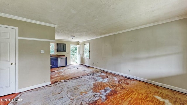 unfurnished living room featuring crown molding and a textured ceiling