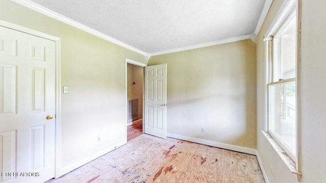 unfurnished bedroom featuring crown molding and light hardwood / wood-style flooring