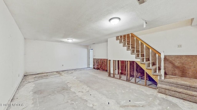 basement with a textured ceiling