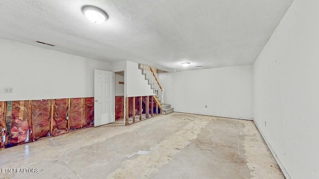 spare room featuring a textured ceiling