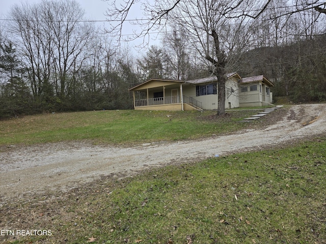 view of front of home with a front yard