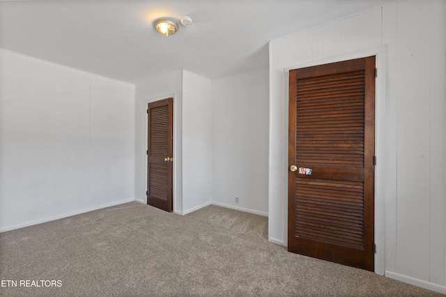 unfurnished bedroom with carpet floors