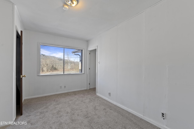 empty room featuring light carpet