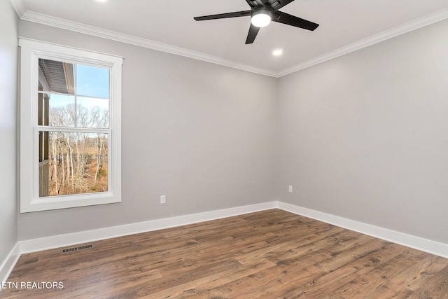 spare room featuring ornamental molding, ceiling fan, and wood-type flooring