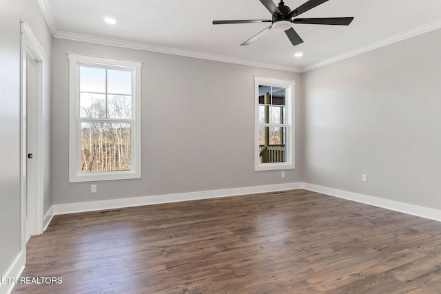 empty room featuring dark wood-type flooring, ceiling fan, and ornamental molding