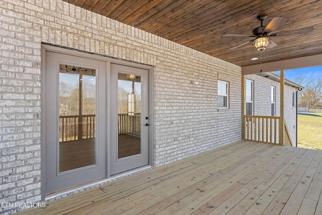 wooden terrace featuring ceiling fan and french doors