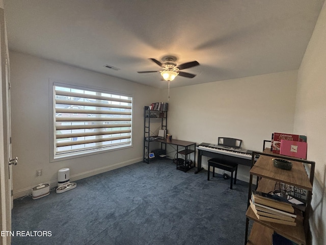 office featuring dark colored carpet and ceiling fan