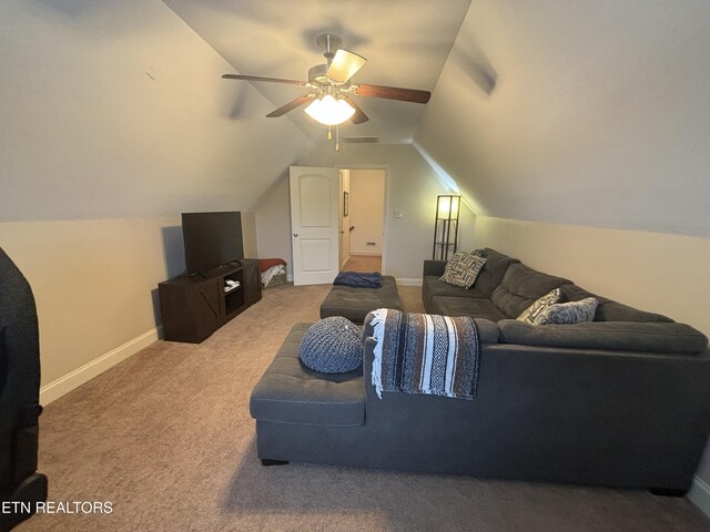 carpeted living room featuring vaulted ceiling and ceiling fan