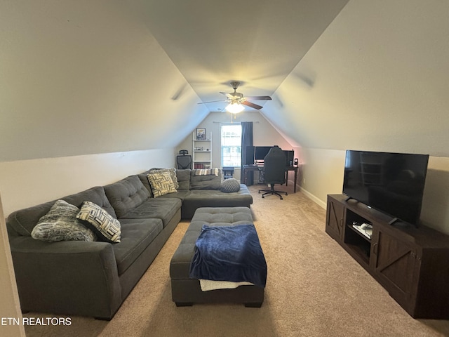 living area featuring carpet floors, baseboards, and lofted ceiling