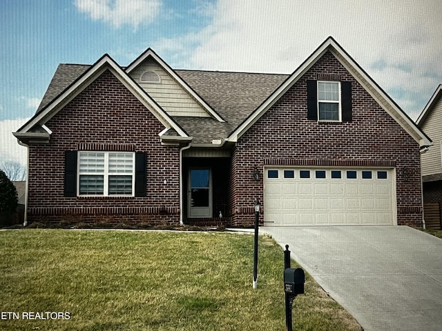 view of front of property with a shingled roof, a front lawn, concrete driveway, and brick siding