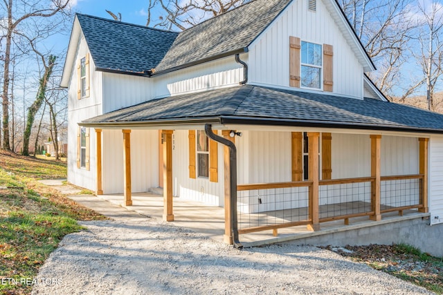 back of property with covered porch