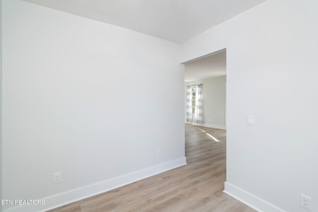 spare room with light wood-type flooring