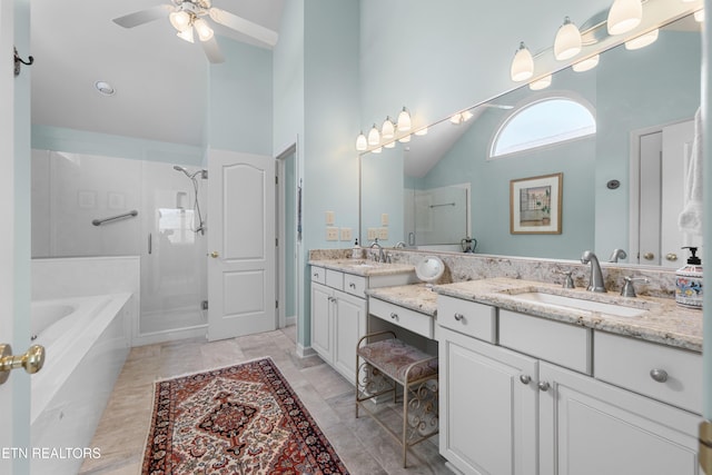 full bathroom featuring high vaulted ceiling, a garden tub, vanity, a ceiling fan, and a shower stall