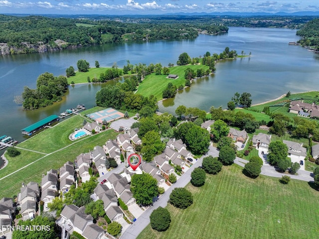 birds eye view of property with a water view and a residential view