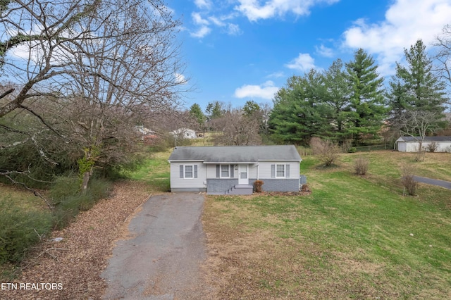 ranch-style home with a front lawn