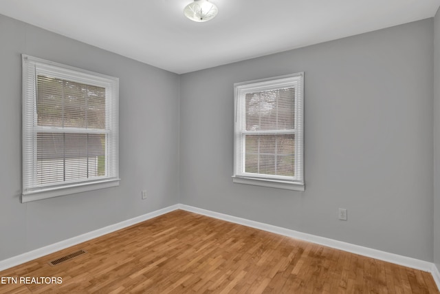 empty room featuring wood-type flooring