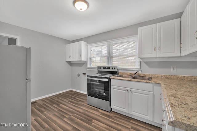 kitchen with sink, stainless steel electric range oven, white fridge, dark hardwood / wood-style flooring, and white cabinetry