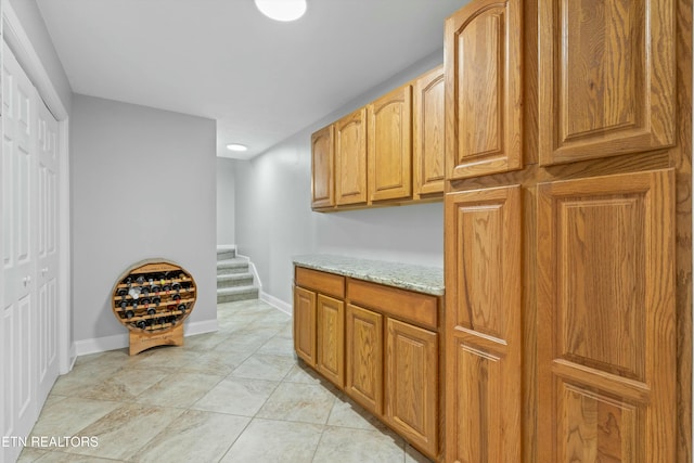 kitchen featuring light stone countertops and light tile patterned floors