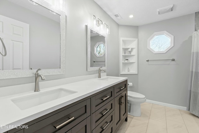 bathroom with built in shelves, a shower with curtain, tile patterned floors, toilet, and vanity