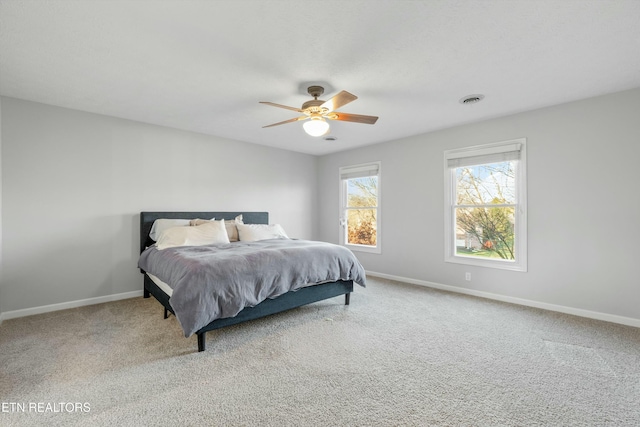 carpeted bedroom featuring ceiling fan