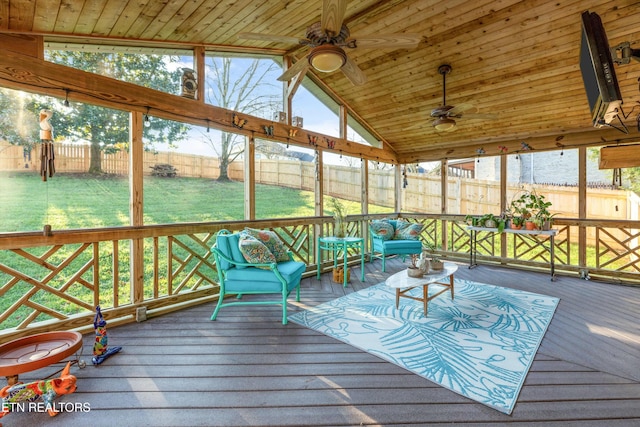 unfurnished sunroom with ceiling fan, a wealth of natural light, lofted ceiling, and wood ceiling