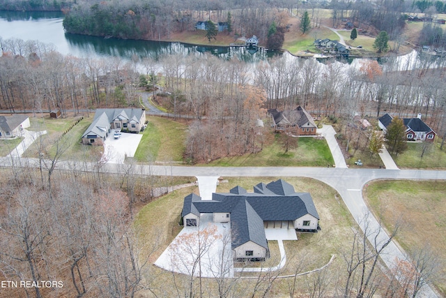 birds eye view of property with a water view