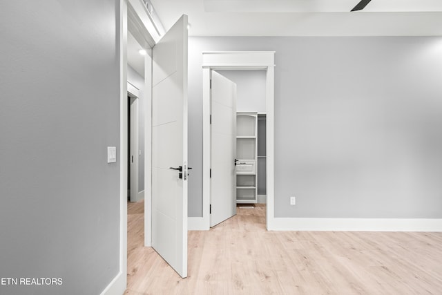 hall with light hardwood / wood-style flooring