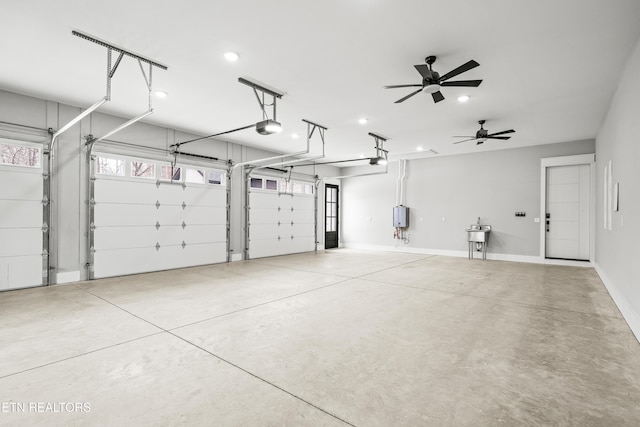 garage with ceiling fan and a garage door opener